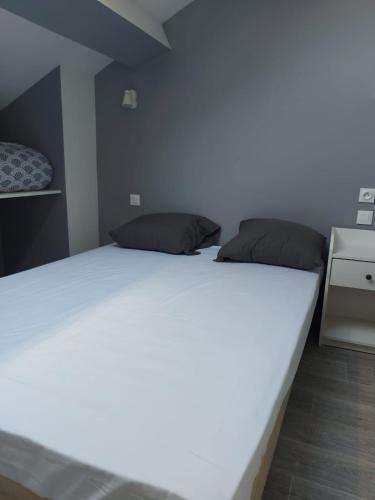 Postel nebo postele na pokoji v ubytování Ardenn'Hotel