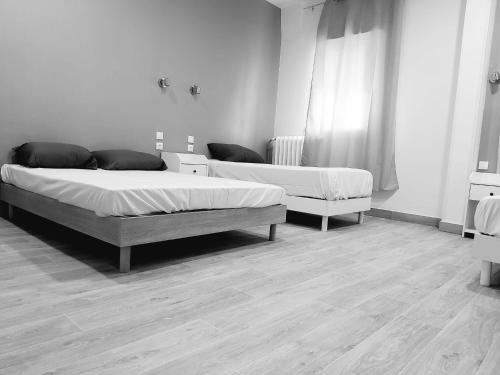 Postel nebo postele na pokoji v ubytování Ardenn'Hotel