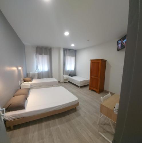 Postel nebo postele na pokoji v ubytování Ardenn'Hotel
