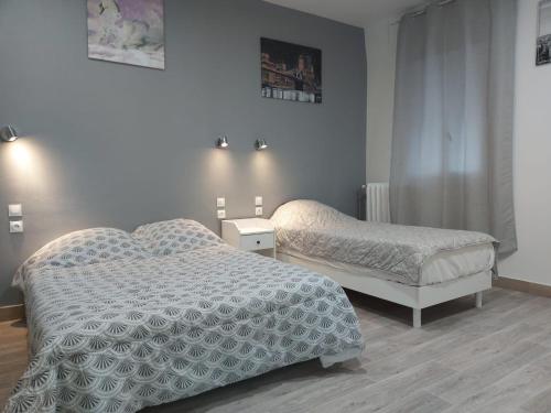 Postel nebo postele na pokoji v ubytování Ardenn'Hotel