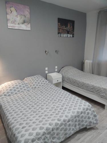 Postel nebo postele na pokoji v ubytování Ardenn'Hotel