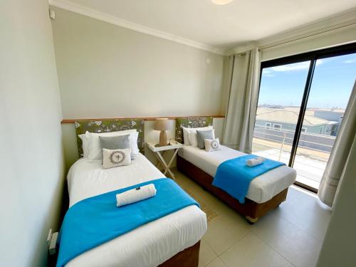 Voodi või voodid majutusasutuse Ocean Whisper Family Condo toas