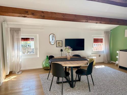 a dining room with a table and chairs at The New Place in Ferrara