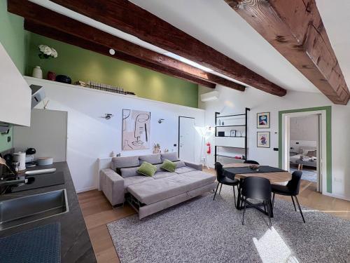 a living room with a couch and a table at The New Place in Ferrara