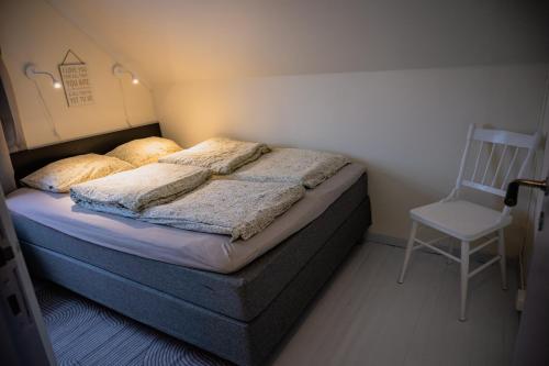 Katil atau katil-katil dalam bilik di Fredfullt hus ved Oksfjordvannet