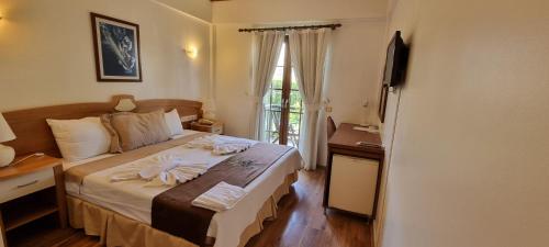 Postel nebo postele na pokoji v ubytování Efe Hotel Gocek