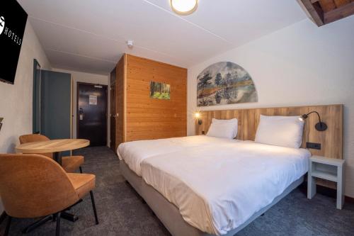 Postel nebo postele na pokoji v ubytování Fletcher Hotel-Restaurant de Witte Brug
