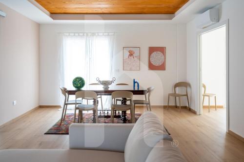 a living room with a table and chairs at Homiday - Villa Sofia in Atri