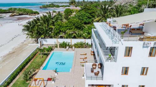 an aerial view of the house and the beach at YU Resort in Msambweni