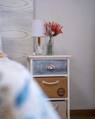 Letto o letti in una camera di Riotorto - Appartamento con terrazzo vista mare e giardino