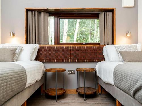 Katil atau katil-katil dalam bilik di Delamere Forest Cabins - Forest Holidays