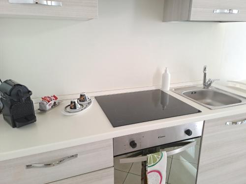 a kitchen with a sink and a counter top at DOMUS CIVITELLA - Chieti in Chieti