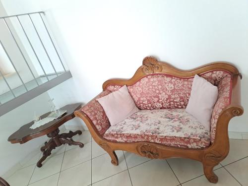 a couch sitting in a room with a table at DOMUS CIVITELLA - Chieti in Chieti