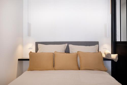 a bedroom with a large bed with white pillows at Saint Honorât, Juan Les Pins Antibes Terrasse in Juan-les-Pins