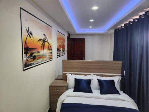 Postel nebo postele na pokoji v ubytování EQUATOR SUITES -KAMPALA -Ivory Mall -Bunga Gaba Road