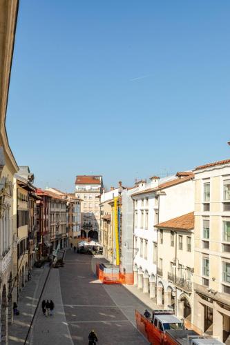 an empty street in a city with buildings at PuRPLE HoUSE CEntro STOriCO UDinE in Udine