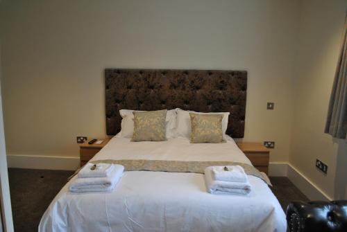 Ein Bett oder Betten in einem Zimmer der Unterkunft Dreams Hotel
