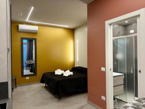 a room with a bed with towels on it at Residence Oasi Di Monza in Monza