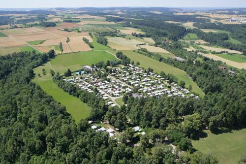 an aerial view of a park with trees and houses at Camping Schüttehof in Horb am Neckar