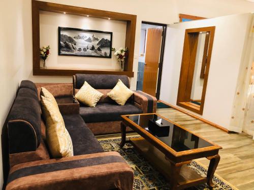 a living room with a couch and a coffee table at Manigram Bishram Batika Pvt Ltd in Bhairahawa
