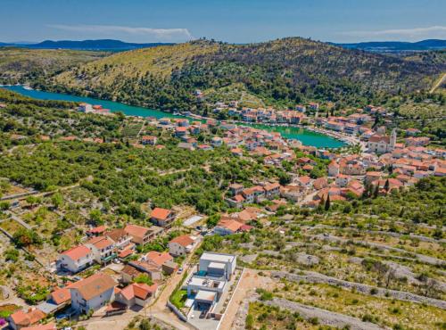 an aerial view of a town next to a river at Villa Šimun Zaton in Zaton