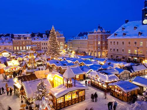 a christmas market in a city at night at Flat near Strasbourg in Offendorf