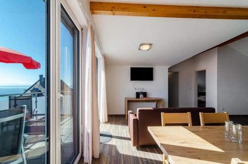 a living room with a view of the ocean at Gästehaus D i c k r e i t e r in Immenstaad am Bodensee