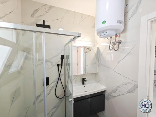 a bathroom with a shower and a sink at Fabius 12 Caesars Resort & Spa in Iskele
