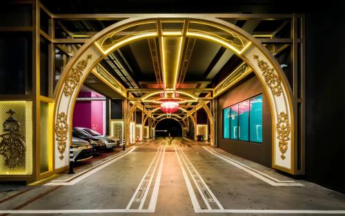 an archway in a building with cars parked at Arte Plus Kuala Lumpur in Kuala Lumpur