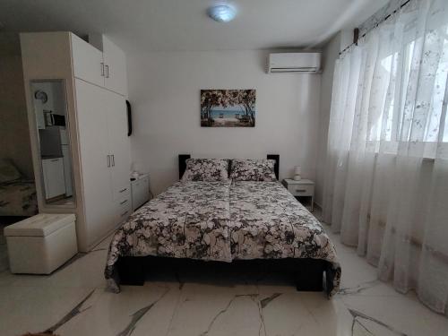 Posteľ alebo postele v izbe v ubytovaní Studio-apartman Ella