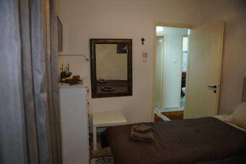 Ένα ή περισσότερα κρεβάτια σε δωμάτιο στο Trikala Apartments