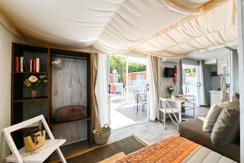 a living room with a couch and a table at San Benedetto Camping Relais in Peschiera del Garda
