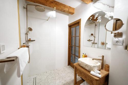 a bathroom with a sink and a shower at Matca Hotel Relais & Châteaux in Şimon