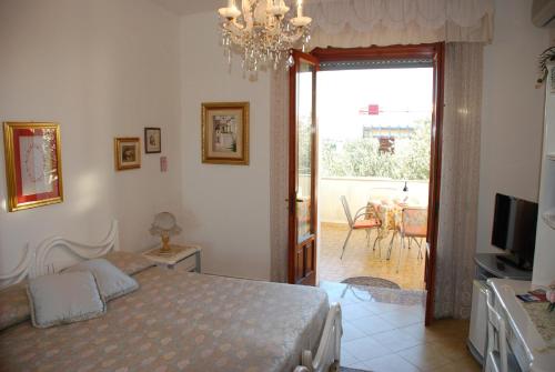 Postel nebo postele na pokoji v ubytování B&B La Rosa Antica