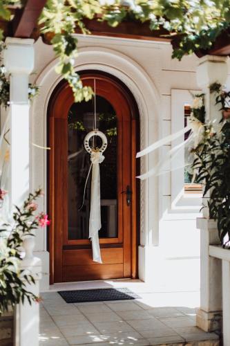 a wooden door with areath on it at Villa Segetski dvori - Tradition since 1964 in Trogir