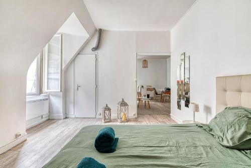 Giường trong phòng chung tại Le Nid - Place Imbach