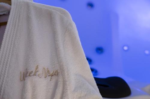 a white towel with the words hello kitty on it at Weekn'spa Tournus in Tournus