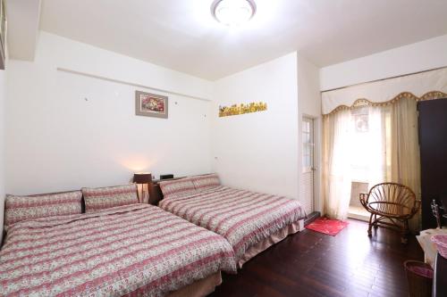 Кровать или кровати в номере Fangyi Homestay