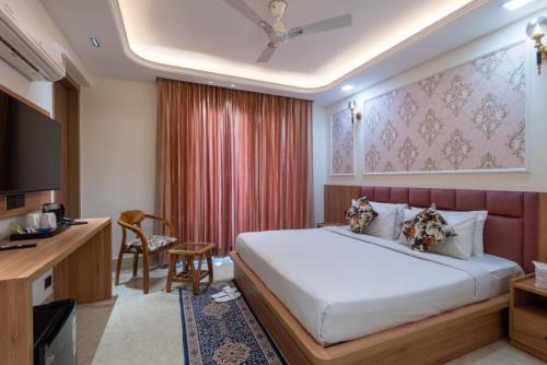 Postel nebo postele na pokoji v ubytování Aatithyam Residency-Golf Course Road Gurgaon