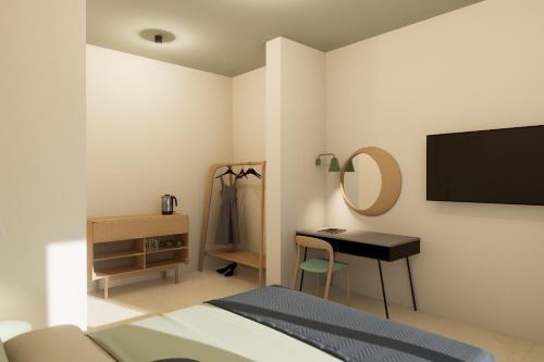 a bedroom with a bed and a desk and a television at Villa Segetski dvori - Tradition since 1964 in Trogir