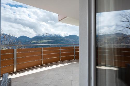 a balcony with a view of the mountains at Haus Pferscher in Barbiano