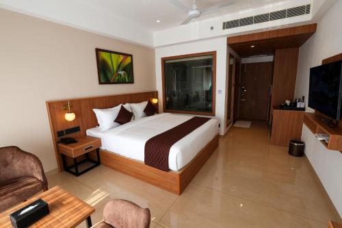 Postel nebo postele na pokoji v ubytování Hotel Saffron Wayanad