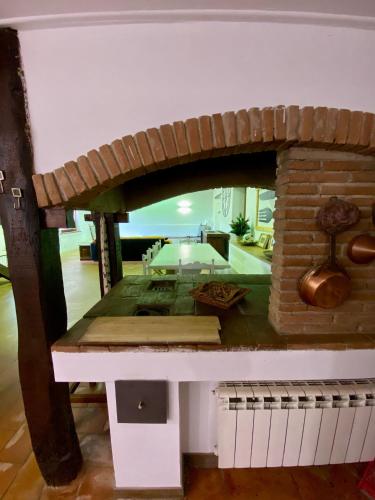 a model of a brick fireplace with a keyboard at Casale Valle Cardinale in Valmontone