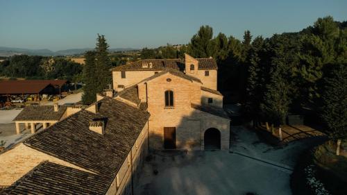 an aerial view of a large building with trees at Agriturismo Pieve San Biagio - Adults Only in Macerata