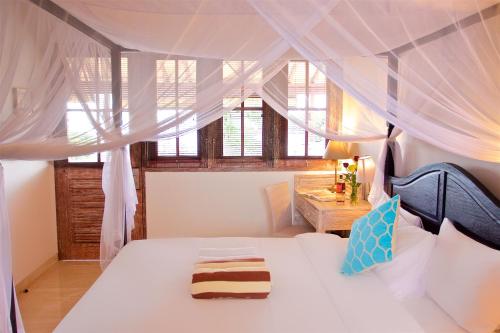 Postel nebo postele na pokoji v ubytování OK Divers Resort & Spa