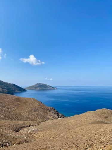 a view of the ocean from the side of a hill at 1900 Hotel in Symi