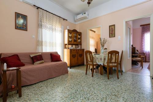 a living room with a couch and a table at Chania Vintage Escape - sea view Gem by old port in Chania Town