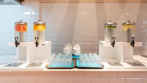 a row of bottles of water on a counter at Bakour Fuerteventura La Pared in La Pared