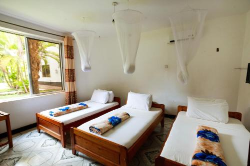 Ένα ή περισσότερα κρεβάτια σε δωμάτιο στο Keys Hotel Mbokomu Branch