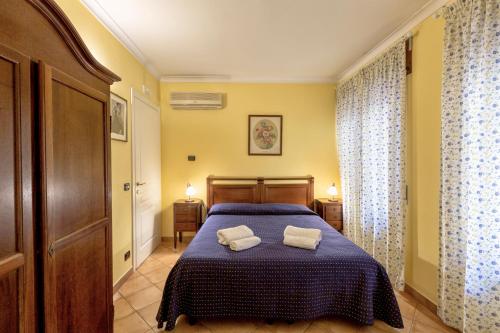 Ένα ή περισσότερα κρεβάτια σε δωμάτιο στο B&B Armonia